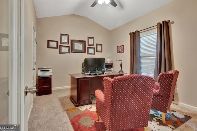 office space featuring lofted ceiling, light colored carpet, and ceiling fan