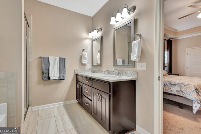 bathroom with vanity, crown molding, ceiling fan, and walk in shower