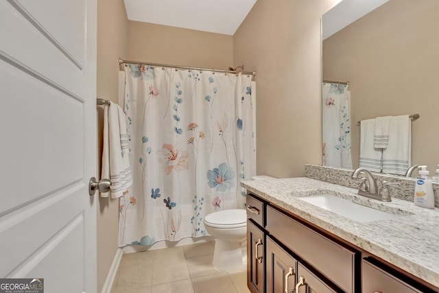 bathroom with vanity, tile patterned floors, and toilet