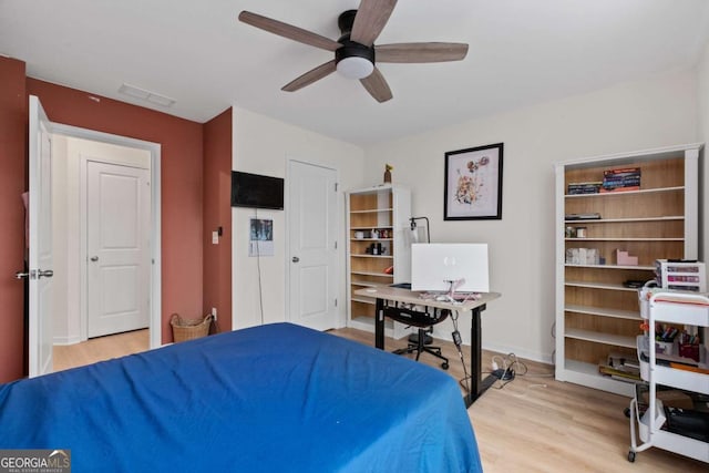 bedroom featuring light hardwood / wood-style floors and ceiling fan