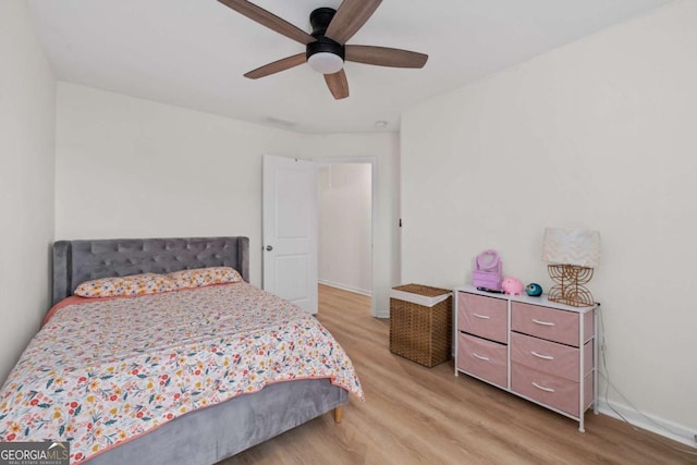 bedroom with ceiling fan and light hardwood / wood-style floors