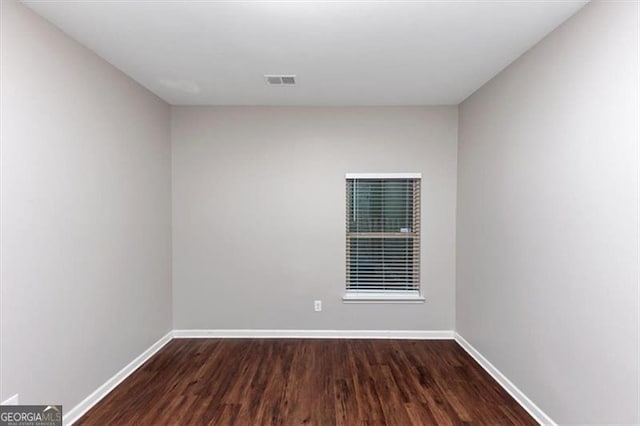 unfurnished room featuring hardwood / wood-style floors