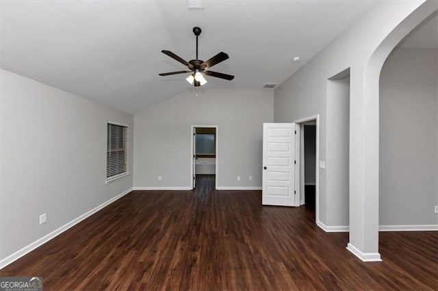 unfurnished bedroom with ceiling fan, lofted ceiling, and dark hardwood / wood-style floors