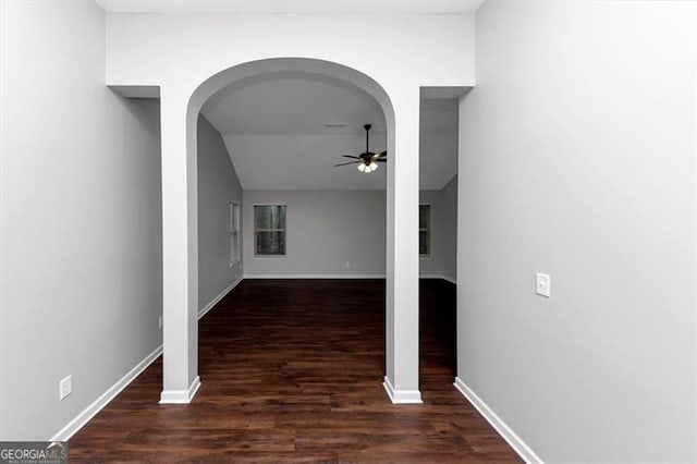 hallway with dark wood-type flooring