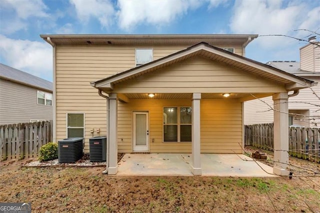 back of house featuring a patio area and central air condition unit