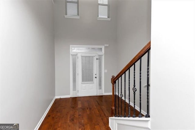 entrance foyer with dark hardwood / wood-style flooring