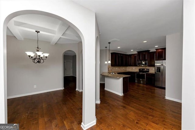 kitchen featuring beamed ceiling, backsplash, hanging light fixtures, coffered ceiling, and stainless steel appliances