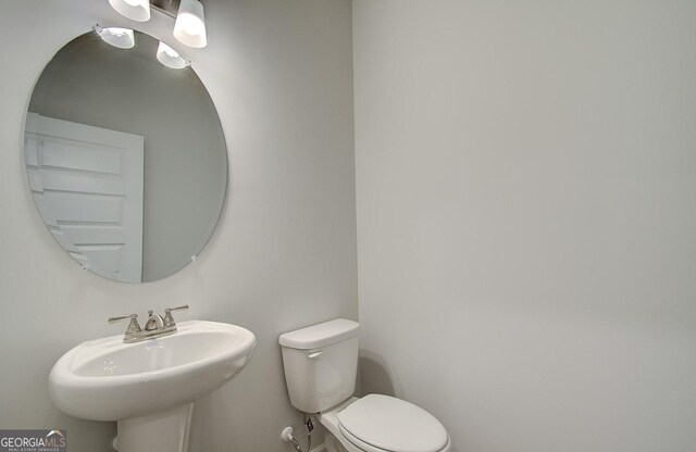 bathroom with toilet and sink