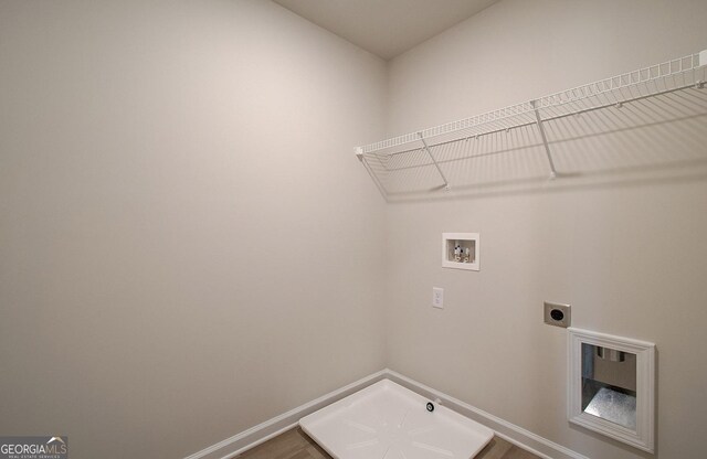 clothes washing area featuring washer hookup and electric dryer hookup