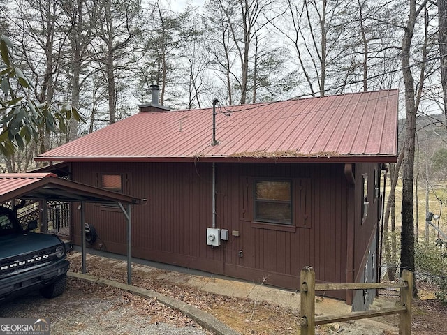 view of side of home featuring a carport