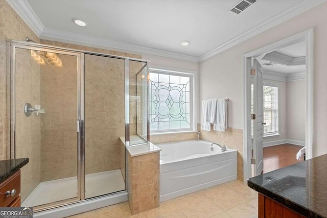 bathroom with ornamental molding, separate shower and tub, vanity, and tile patterned floors