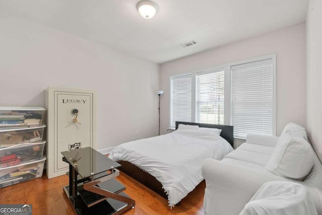 bedroom featuring hardwood / wood-style floors