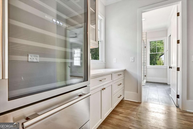 bathroom featuring vanity and hardwood / wood-style floors