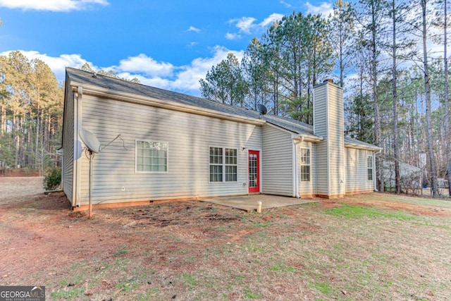 rear view of property with a patio area