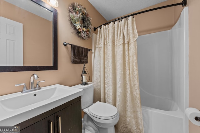 full bathroom featuring vanity, toilet, a textured ceiling, and shower / bath combo with shower curtain