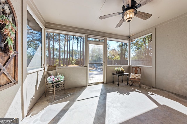 sunroom featuring ceiling fan