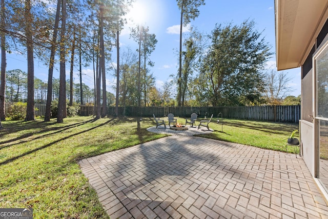 view of patio featuring an outdoor fire pit