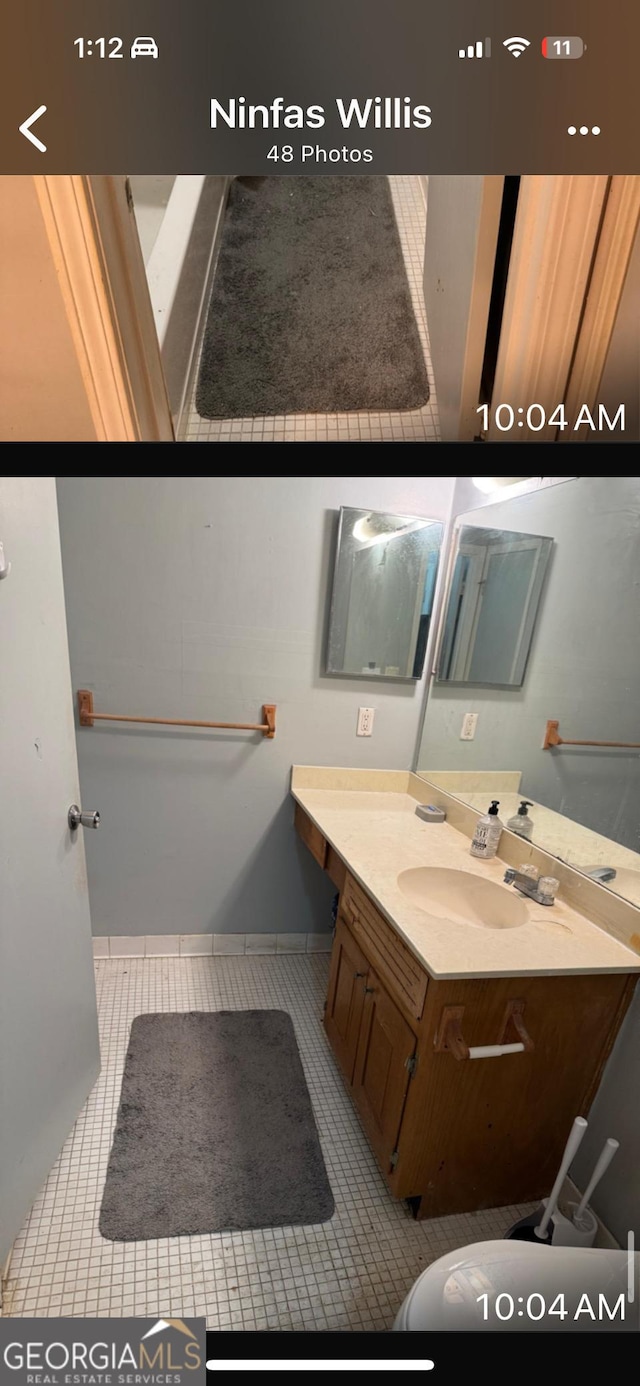 bathroom with vanity and tile patterned flooring