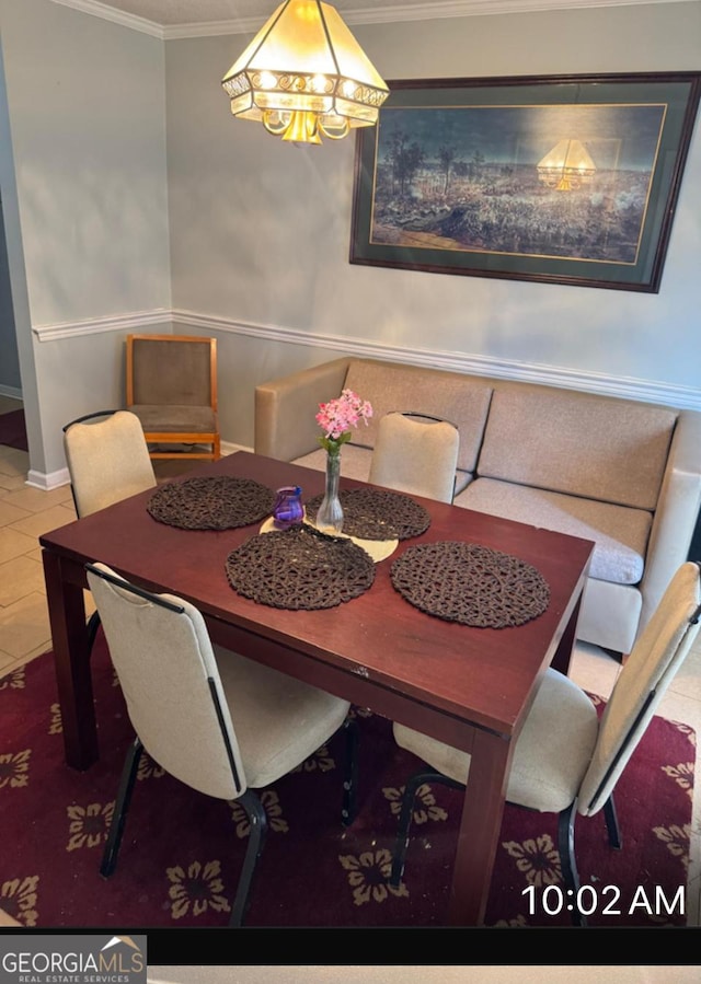 tiled dining area with ornamental molding