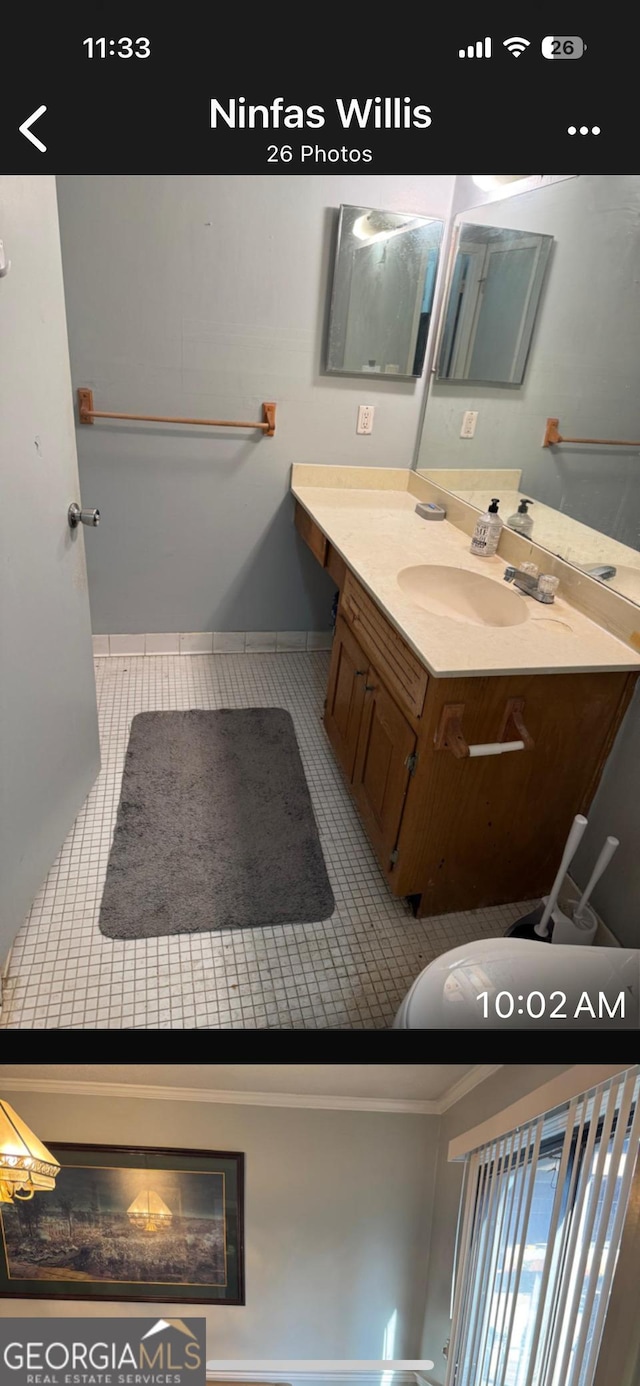 bathroom with tile patterned floors and vanity