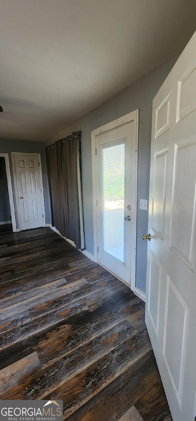 interior space with dark wood-type flooring