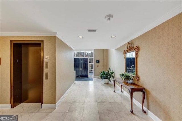 hallway with ornamental molding and elevator