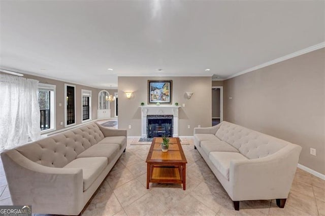 living room with crown molding, a high end fireplace, light tile patterned floors, and a notable chandelier