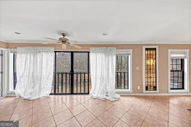 unfurnished living room with crown molding, ceiling fan, and light tile patterned flooring