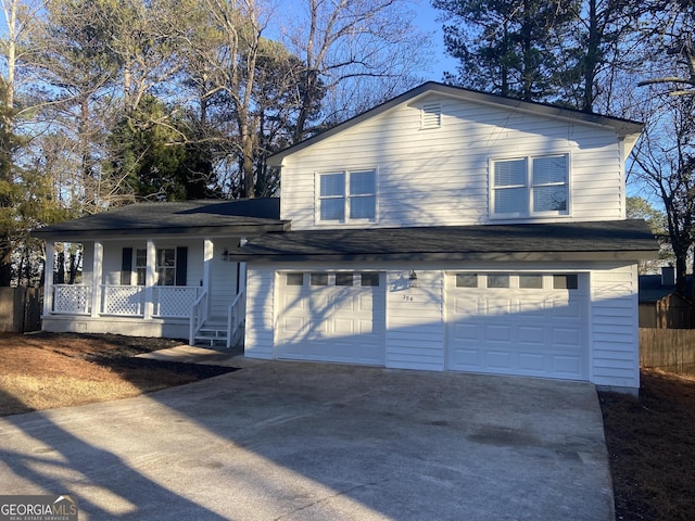 view of front of home featuring a porch and a garage