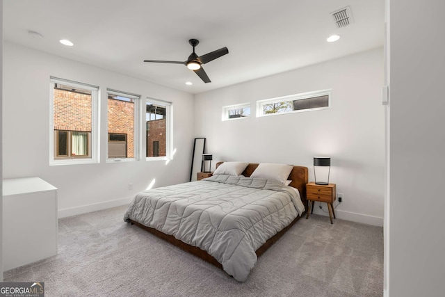 bedroom featuring ceiling fan and light colored carpet