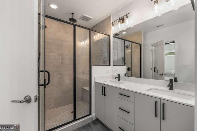 bathroom with an enclosed shower and vanity