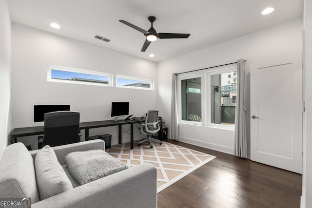 office featuring dark hardwood / wood-style floors and ceiling fan