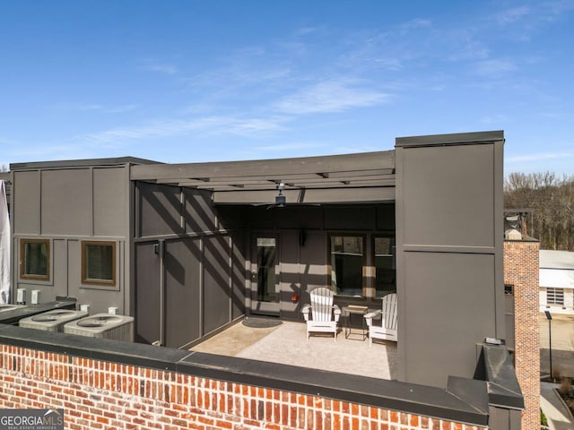 exterior space with a patio and central AC unit