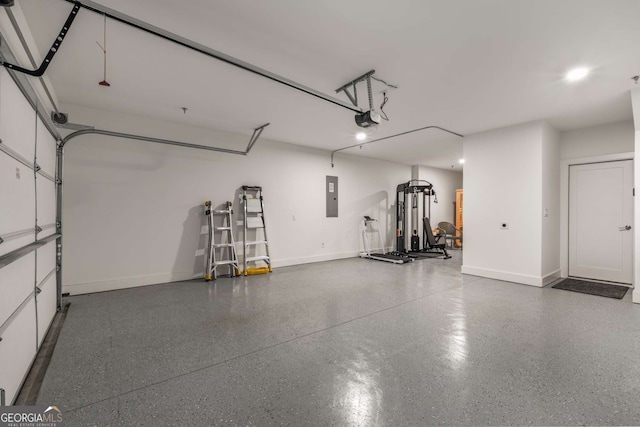 garage featuring a garage door opener and electric panel