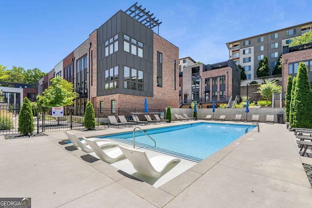 view of swimming pool with a patio