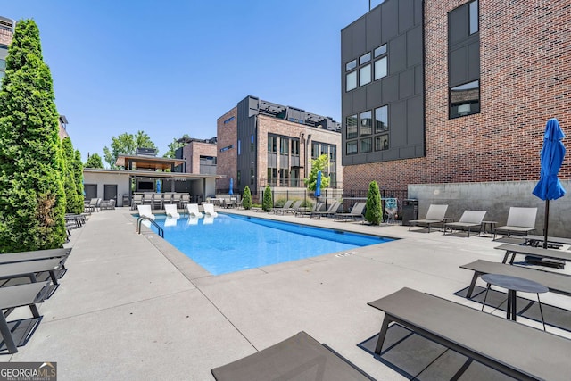 view of pool featuring a patio