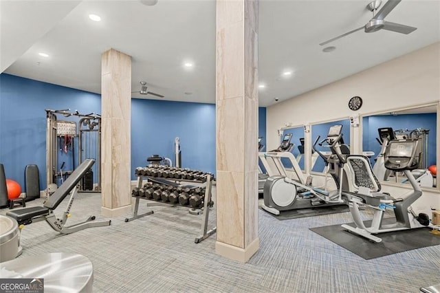 gym featuring carpet floors, decorative columns, and ceiling fan