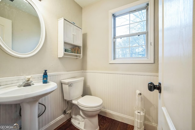 bathroom featuring sink, hardwood / wood-style floors, and toilet