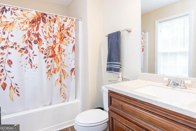 full bathroom with vanity, shower / bathtub combination with curtain, and toilet