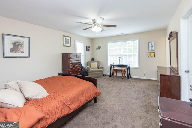 bedroom featuring ceiling fan and carpet