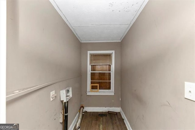 washroom with hardwood / wood-style flooring and ornamental molding