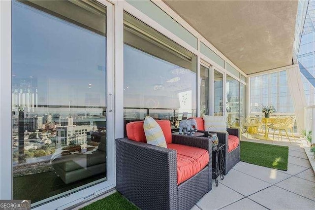 balcony featuring outdoor lounge area and a patio