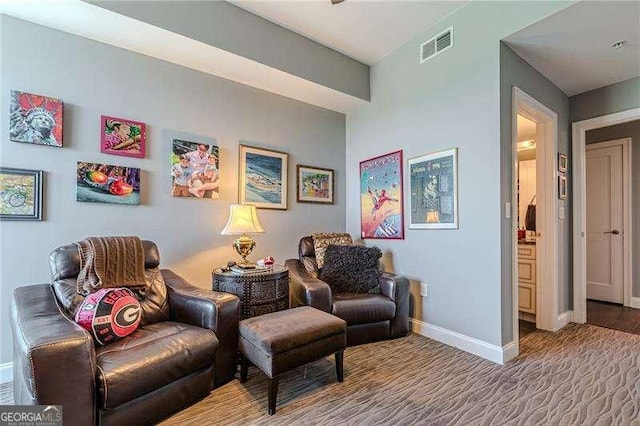 sitting room featuring carpet floors