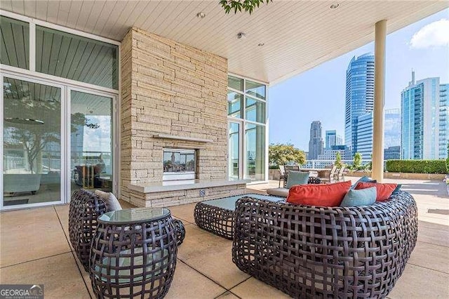 view of patio / terrace with an outdoor stone fireplace