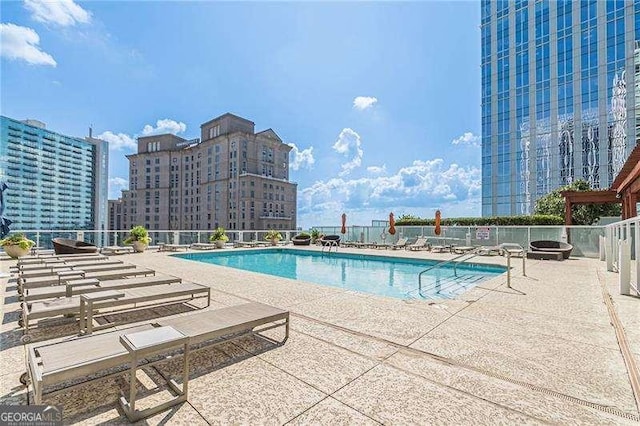 view of swimming pool featuring a patio