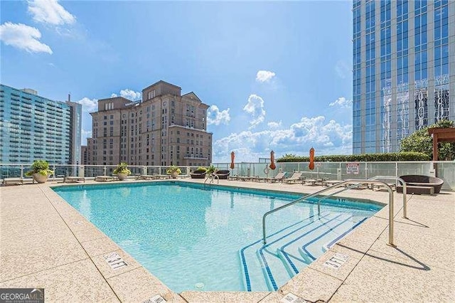 view of pool featuring a patio area