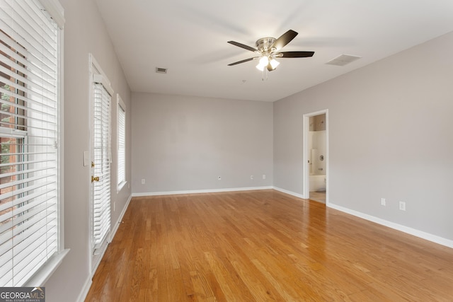 empty room featuring ceiling fan and light hardwood / wood-style flooring