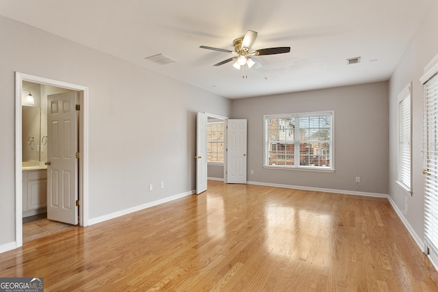 unfurnished bedroom with ceiling fan and light wood-type flooring