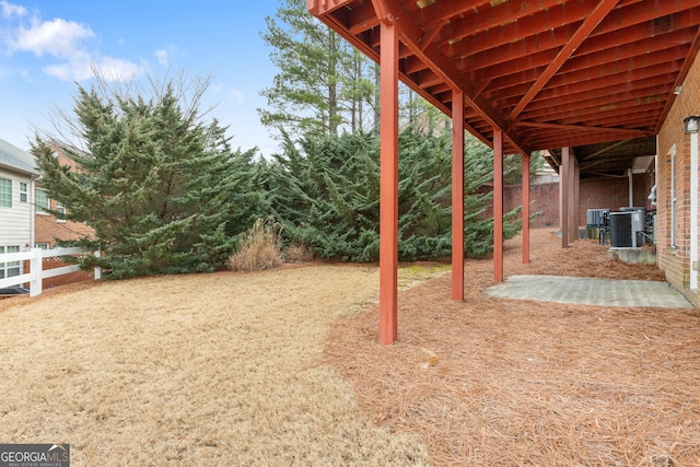 view of yard featuring central air condition unit