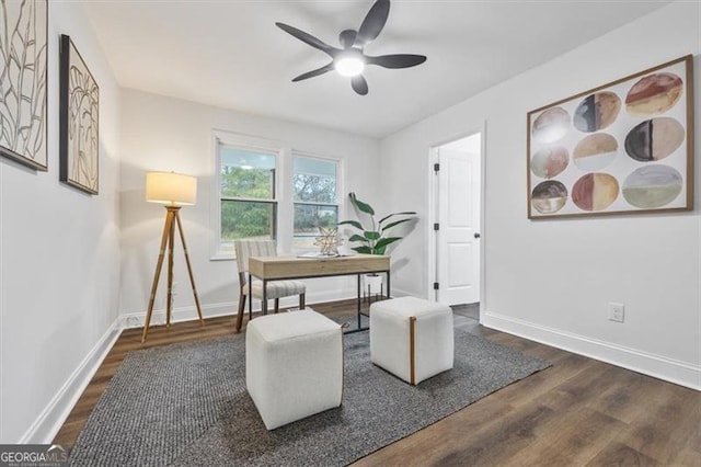 office space with ceiling fan and dark hardwood / wood-style flooring